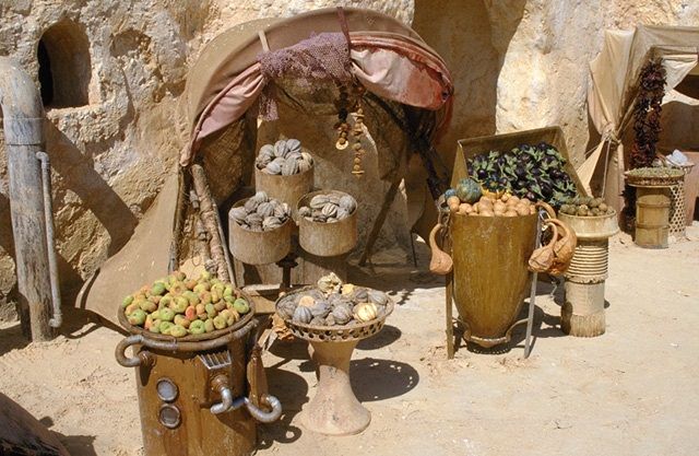 A vendor displaying their fresh foods in the Mon Espa market